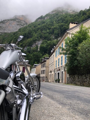 Motorcycle in a stone village street on the French side of the Pyrenees