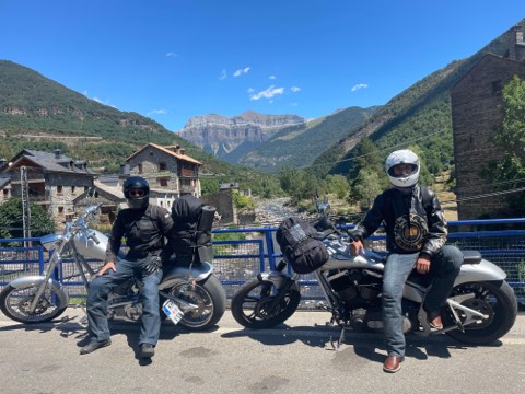 Riders and motorcycles near the Ibon de Tramacastilla, Aragon